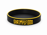 Coupelle noire de nourrissage pour crevettes avec bordure et inscription jaunes